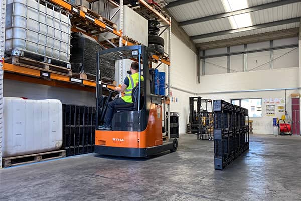 Reach Forklift with a student conducting training in a warehouse setting