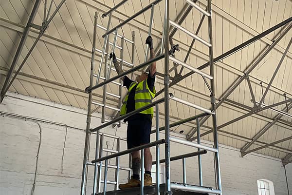 a man building a tower